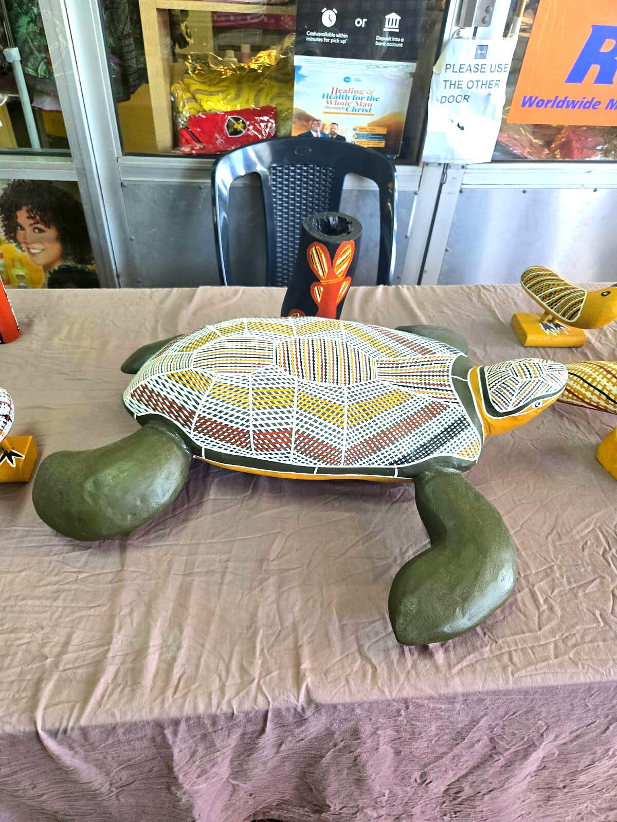 Yolŋu carved and painted turtle sculpture with rarrk crosshatching on shell
